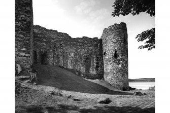 Castle Sween. 
General view of West wall and round tower from North-East.