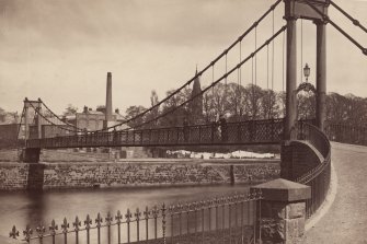 Historic photograph showing general view of suspension bridge.