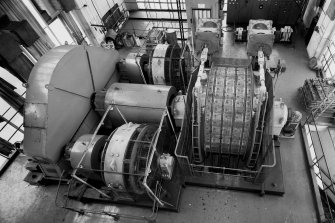 Elevated view of No.1 winder, a multi-rope friction winder for winding coal skips, with two electric motors @ 1350hp, 700v DC. full winding speed 9.4mps at 56.5 rpm drum speed, Seafield Colliery