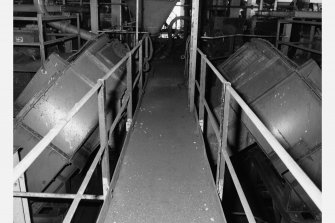 Detail of two drumboys inside coal preparation plant, Seafield Colliery