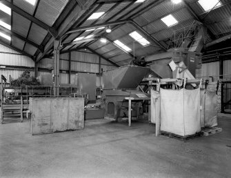 General view from E of Stem Mill, which comprises shaking conveyors which shake off sand and shells (left), and primary and secondary mills (centre and right)