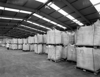 View from E in Weed Store, showing sacks of milled weed awaiting processing into alginate
