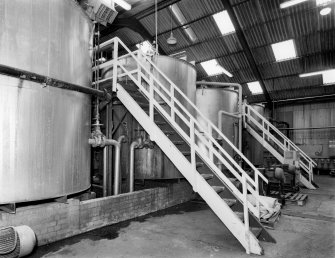 View from NE of Mature Tanks, in which milled weed matures at approximately 80 degrees C for 3-4 hours, after first being mixed with hot water and alkali.  There are ten operational welded-steel cylindrical tanks, the output of which is sodium alginate paste