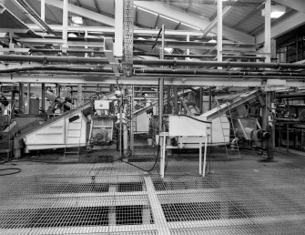General view of Leaching Area, showing Con Vat and Dejuicer Units.  In this process, the Calcium Alginate is reacted with sulphuric acid in staged additions, resulting in the removal of the calcium and the creation of the Alginic Acid