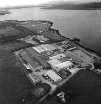 Aerial view of Barcaldine Alginate Works looking to the South West.  Distant view of the Creran Moorings Marina and the Sand and Gravel Quarry operated by J&A Gardner, also the mouth of Loch Creran and the Firth of Lorne and the sea beyond.