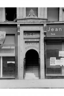 View of the main entrance on the South facade of the 'Grecian Building' at No. 336 - 356 Sauchiehall Street, Glasgow. Above the doorway is insc. '346. Stage Furnishings Ltd.'