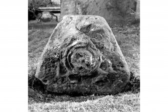 View from end of head panel of coped grave marker.