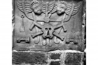 Detail of carved plaque on burial vault.