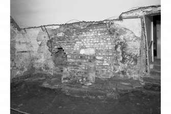 View from South West showing flag floor and brick rebuilding, room 5