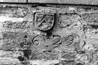 Detail of 1629 lintel and heraldic skewput.