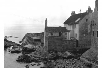 Gyles House,
View of rear over rocks.