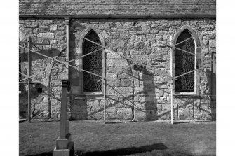 Detail of south wall showing datum, with scaffolding.