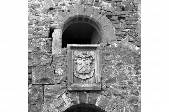 Detail of 19th century armorial built into original main entrance of tower (E stair)