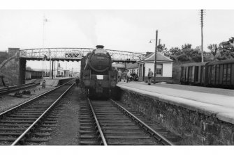 View of Dingwall Station looking South with locomotive (no. 44978). The sign on the front reads: 'RCTS SLS, Scottish Rail Tour, June 1962'.

