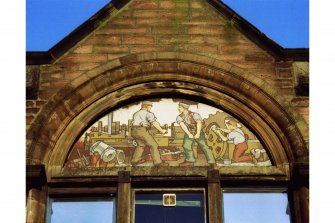 Rose Street Foundry Office, 96-104 Academy Street.
Detail of (left) North West panel on Academy Street frontage showing men building engines and machinery.