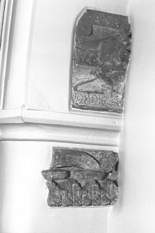 Interior-detail of carved fragments inside church on East wall