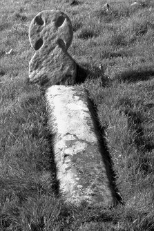 St Blane's, Kingarth. Cruciform grave-marker (no.15) and grave slab.