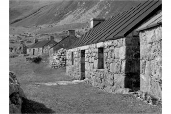 Village, Houses 3,4 and 5.
View from East along street.