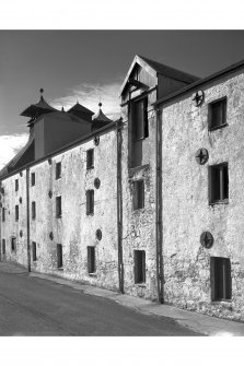 Ardbeg Distillery, East Malt Barn.
View of East Wall, showing kiln 'pagoda' roofs, loading doors, windows and wall plate tiles.