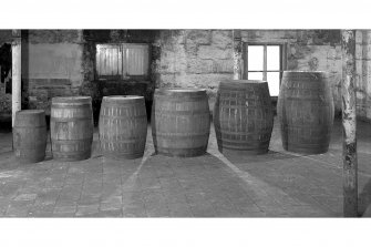 Bruichladdich Distillery, Islay.
Interior view of range of cask sizes: reading from left to right - quarter (obsolete), American barrel, hogshead, puncheon, butt.