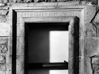 Detail of inscribed lintel above original doorway