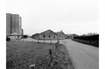 View from SW showing S blocks of duty-free warehouses, with Glenesk Maltings buildings on the left