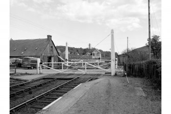 Rogart Mills and Rogart, Station
View from W showing level crossing, signal box and S building of mills