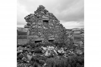 Detail of W gable (interior) showing double fireplaces in ground floor.