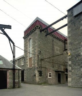 Scan of D 47654/CN. Riverside Mill, Selkirk. View from north east of former engine house (originally housed a beam engine), with cast-iron water tank on roof.