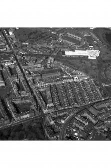 Scanned image of Oblique aerial view of Easter Road, showing Eastern Cemetery and Albion Road, Easter Road Stadium