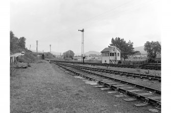 Garve, Station
General view looking N along tracks with signal box in foreground, cast-iron bridge (NH36SE 3) in background