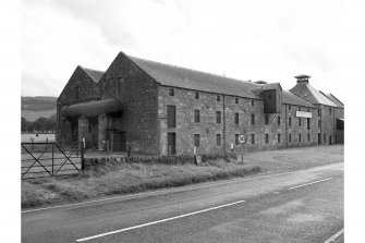 Pitlessie, Priestfield Maltings
View of N frontage of buildings from NE, kilns in right background