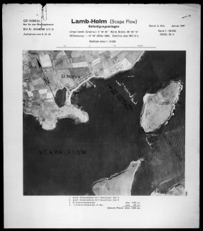 Scanned image of Luftwaffe vertical air photograph of Lamb Holm and Kirk Sound showing blockships, St Mary's and two heavy anti-aircraft positions to the W of the village.		.		