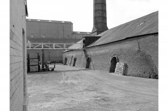 Armadale, Etna Brickworks
View from N showing ENE front of W Hoffman kiln and main buildings in background. Both 10 chamber kilns were demolished in 1984.