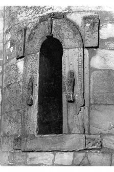 Historic photographic view of doorway in round tower.
