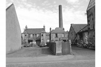 Dunfermline, 31-35 Campbell Street, Terraced Housing
View from S showing S front and Victoria Works chimney