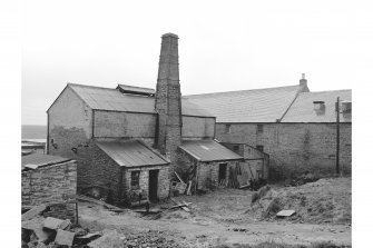 Stromness, North End, Stromness Harbour
View from NW showing chimney, WNW front and NNE front of retort house