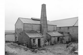 Stromness, North End, Stromness Harbour
View from NW showing chimney, WNW front and NNE front of retort house