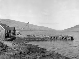 Voe, Jetty
View from ESE showing ESE front of jetty and NNE front of fish processing plant