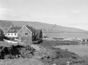 Voe, Jetty
View from E showing ESE and NNE fronts of fish processing plant and ESE front of S half of jetty