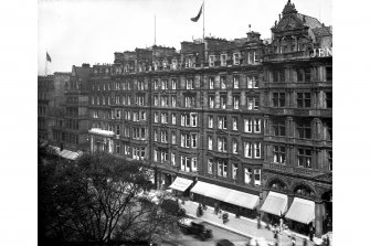 General view of Nos 47 - 59 Princes Street showing awnings on shop fronts and cars parked outside