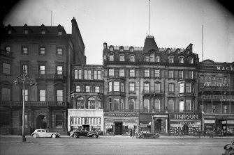 View of 109 - 111 Princes Street, Edinburgh, from south, with Lotus & Delta Shoes, John Taylor & Son, Willerby's, Timpson and Mackies.