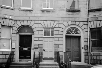 Contrast of D fanlight on common stair with A type on adjoining house (Plate glass evidently substituted in no.55)