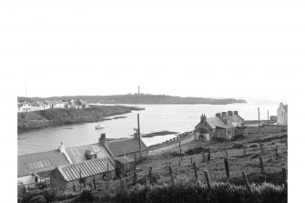 Islay, Portnahaven, 1-23 King Street, Terraced Cottages
View from NE showing NW front of numbers 15-23 and NE corner of pier with Islay lighthouse in distance