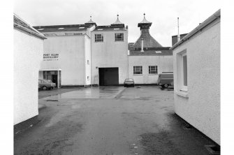 Islay, Port Ellen Distillery
General view looking NNE through main entrance on SSW front showing tops of malting kilns in background