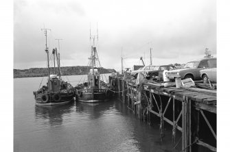 Islay, Port Ellen, Pier
View from NNE showing fishing boats docked on E front of wood and iron steamer pier extension