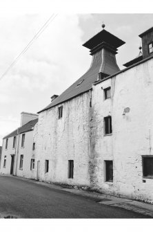 Islay, Ardbeg Distillery
View from N showing NE front of pyramidal-roofed kiln at the S of malt barn which is 11 bays long