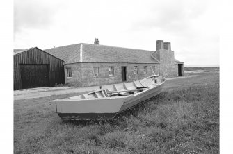 Tugnet, Ice-house and Fishery
View from NNW showing WNW front of boiling house with boat in foreground