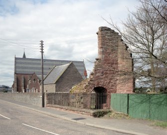 General view of gate-house and abbey church, from S