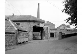 Peterculter, Paper Mill
View from SSE showing entrance, chimney and N buildings